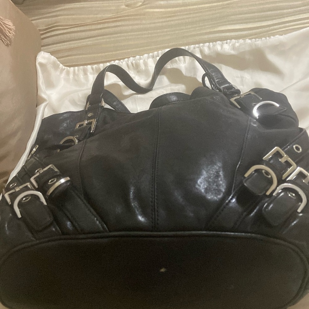 Michael Kors black leather with buckle straps on both sides